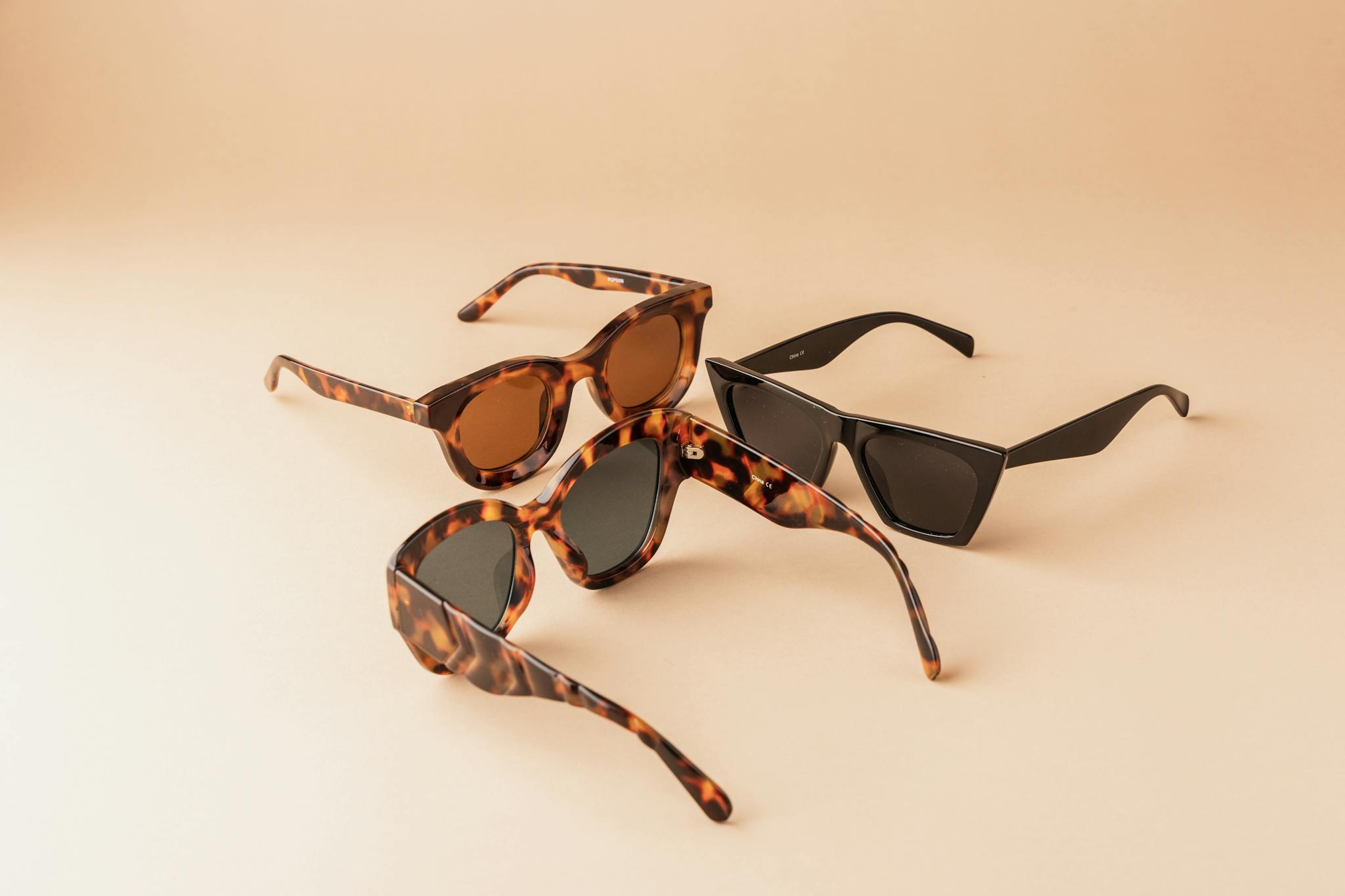 A modern display of three elegant sunglasses, perfect for summer fashion.
